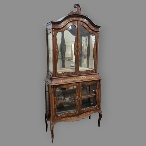 76 - An Edwardian mahogany and marquetry inlaid vitrine cabinet, with shaped glazed panelled doors, heigh... 