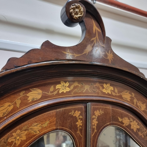 76 - An Edwardian mahogany and marquetry inlaid vitrine cabinet, with shaped glazed panelled doors, heigh... 