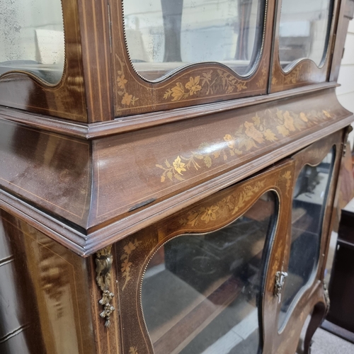 76 - An Edwardian mahogany and marquetry inlaid vitrine cabinet, with shaped glazed panelled doors, heigh... 