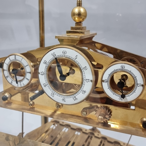 78 - A 20th century brass Congreve clock, with rolling ball fusee movement housed in glass display cabine... 