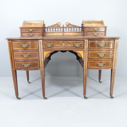 2000 - A late Victorian rosewood and marquetry inlaid Carlton House style writing desk, With lid and drawer... 