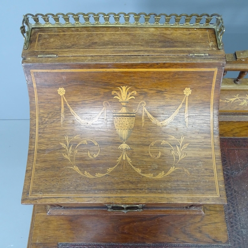 2000 - A late Victorian rosewood and marquetry inlaid Carlton House style writing desk, With lid and drawer... 