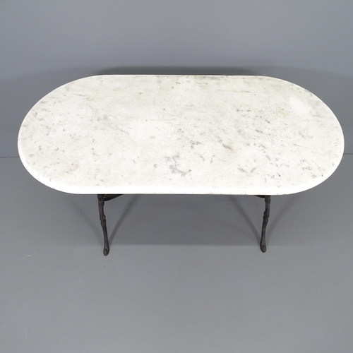 2011 - An oval marble-topped garden table on cast iron base. 122x72x60cm.