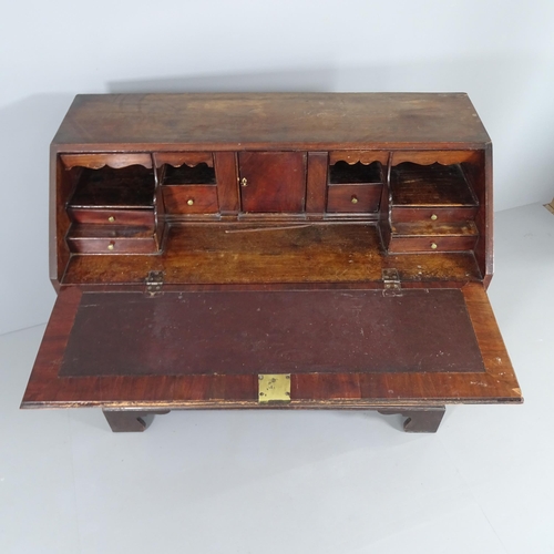 2013 - A Georgian mahogany two-section bureau, the fall front revealing a fitted interior with three long d... 