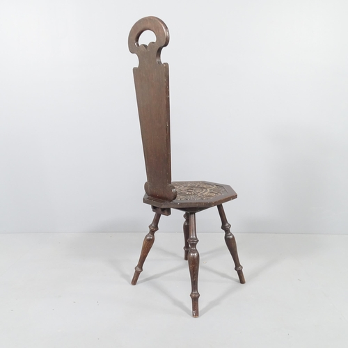 2014 - An antique oak spinning stool, with carved seat and removable back panel.