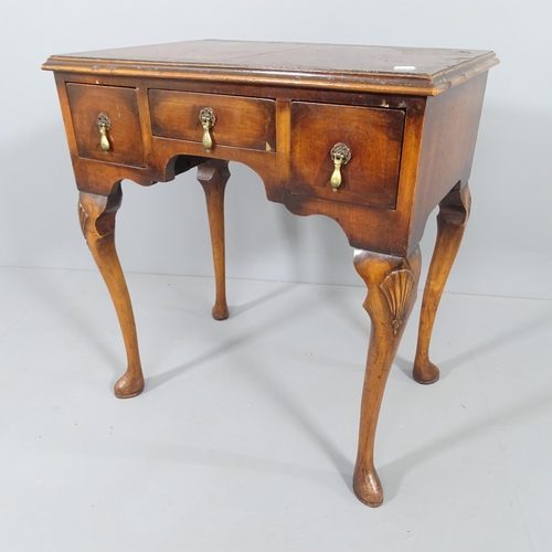 2015 - A 19th century mahogany lowboy desk, with three fitted drawers and raised on cabriole legs. 64x72x45... 