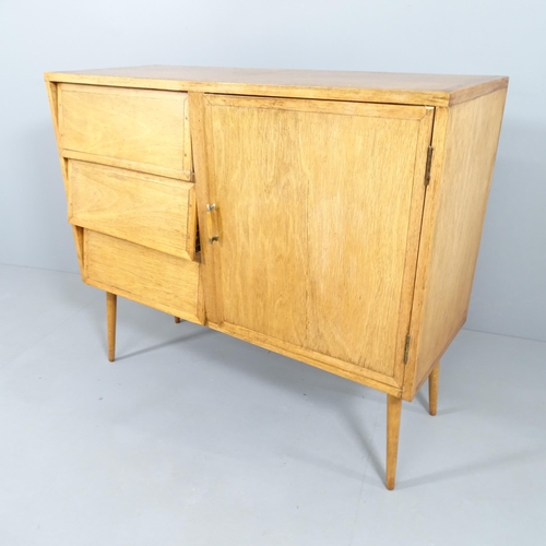 2018 - A mid-century style teak sideboard with three drawers besides single cupboard, and raised on tapered... 