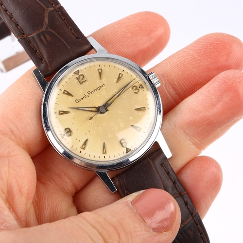 1028 - GIRARD-PERREGAUX - a Vintage stainless steel mechanical wristwatch, silvered dial with gilt quarterl... 