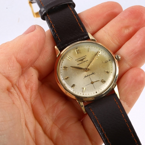 1048 - LONGINES - a gold plated stainless steel Grand Prize automatic wristwatch, silvered dial with gilt A... 