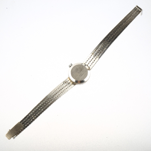 1057 - ROAMER - a lady's 9ct white gold sapphire and diamond mechanical cocktail bracelet watch, silvered d... 