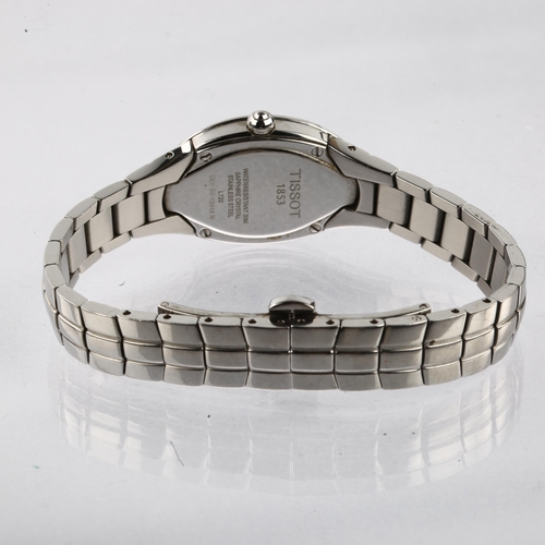 1058 - TISSOT - a lady's stainless steel T-Trend Oval quartz bracelet watch, ref. L720, mother-of-pearl dia... 