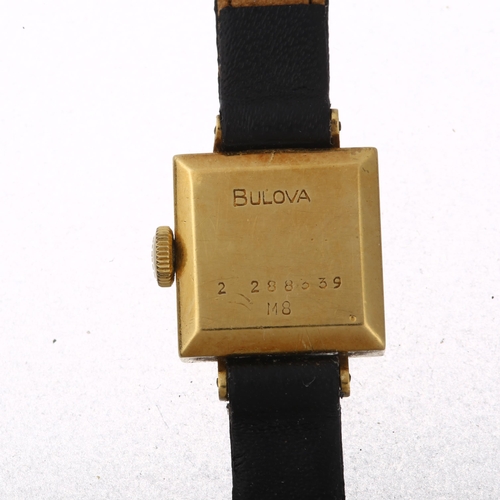 1059 - BULOVA - a lady's 18ct gold mechanical wristwatch, silvered dial with gilt quarterly baton hour mark... 