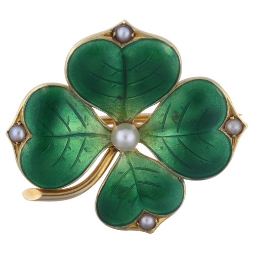 1100 - An 18ct gold pearl and green enamel four leaf clover brooch, circa 1900, with engraved leaf veins, b... 