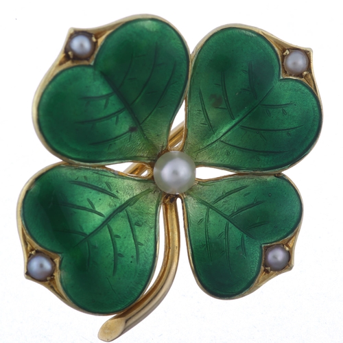 1100 - An 18ct gold pearl and green enamel four leaf clover brooch, circa 1900, with engraved leaf veins, b... 