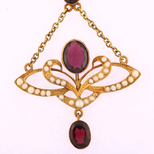 1102 - An Edwardian 15ct gold garnet pearl and diamond openwork drop pendant, with central floral motif set... 