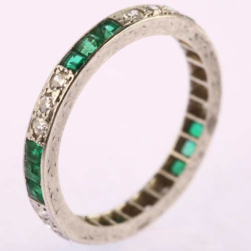 1105 - An emerald and diamond full eternity ring, unmarked white metal settings with trio of single-cut dia... 