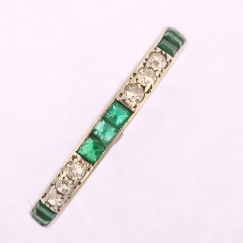 1105 - An emerald and diamond full eternity ring, unmarked white metal settings with trio of single-cut dia... 