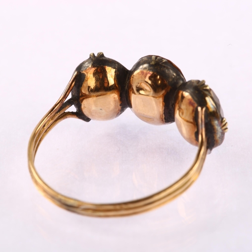 1121 - A Georgian three stone citrine ring, unmarked gold closed back settings set with oval mixed-cut citr... 