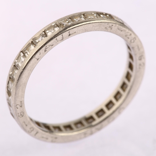 1123 - CARTIER - a diamond full eternity ring, unmarked white metal settings with channel set square step-c... 