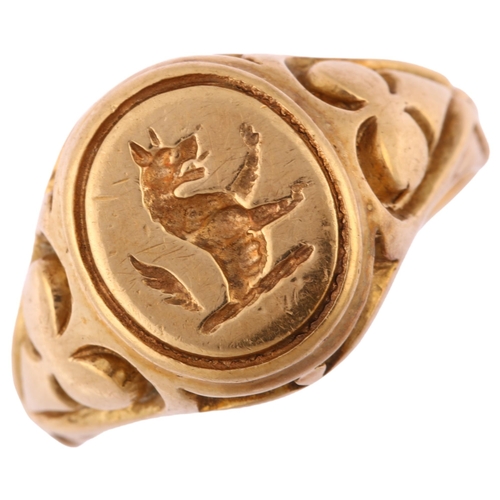 1126 - A late 20th century 9ct gold armorial seal signet ring, intaglio engraved with rampant wolf, maker's... 