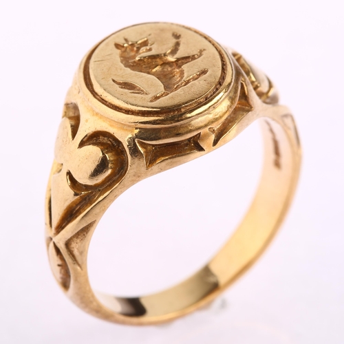 1126 - A late 20th century 9ct gold armorial seal signet ring, intaglio engraved with rampant wolf, maker's... 