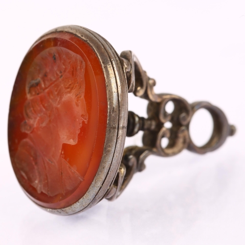 1127 - An Antique carnelian intaglio seal fob, with carved Classical male profile, unsigned, in white metal... 