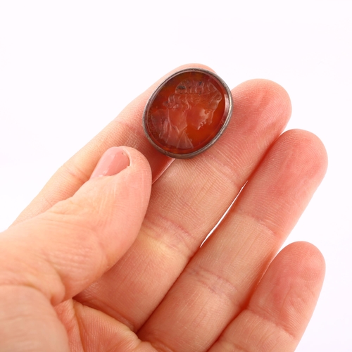 1127 - An Antique carnelian intaglio seal fob, with carved Classical male profile, unsigned, in white metal... 