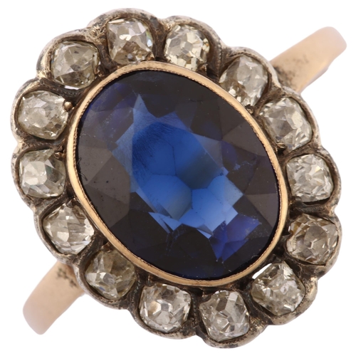 1128 - A mid-20th century synthetic sapphire and diamond oval cluster ring, Continental gold settings with ... 