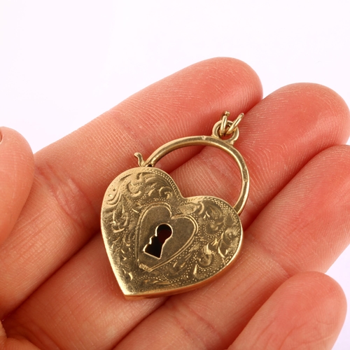 1131 - A 9ct gold heart padlock clasp/pendant, possibly Antique and re-hallmarked, engraved foliate and hea... 