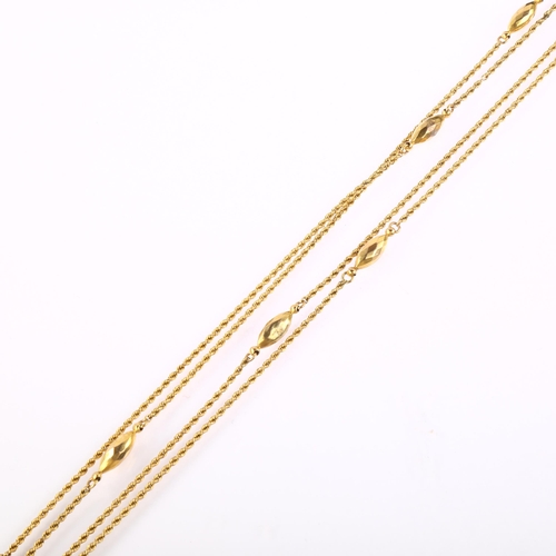 1134 - An Antique 9ct gold fancy link long guard chain necklace, with rope twist links and faceted torpedo ... 