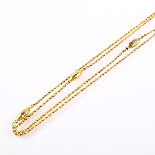 1134 - An Antique 9ct gold fancy link long guard chain necklace, with rope twist links and faceted torpedo ... 