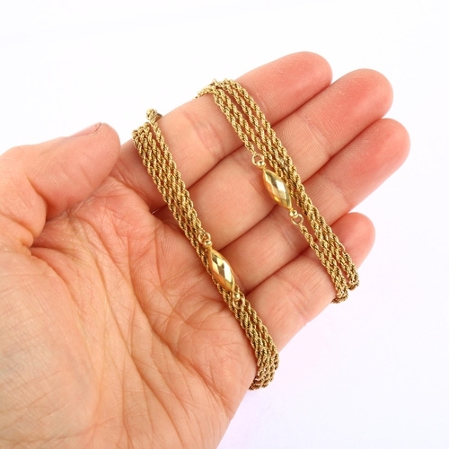 1134 - An Antique 9ct gold fancy link long guard chain necklace, with rope twist links and faceted torpedo ... 