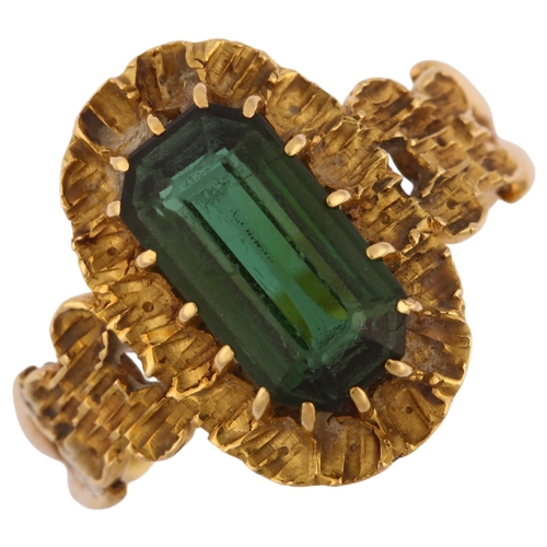 1140 - An early 20th century 18ct gold green tourmaline dress ring, set with octagonal step-cut tourmaline ... 