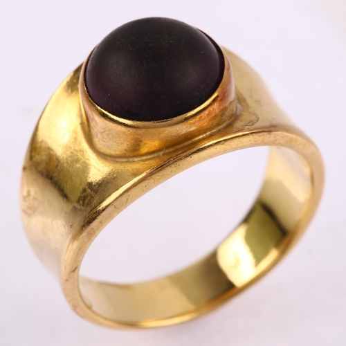 1142 - GEORG JENSEN - a Danish modernist 18ct gold amethyst ring, circa 1970, bezel set with round cabochon... 