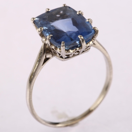 1144 - A solitaire sapphire ring, unmarked white metal settings, set with oval mixed-cut sapphire, sapphire... 