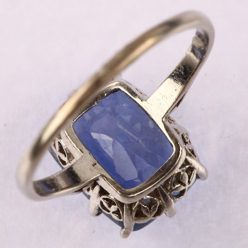 1144 - A solitaire sapphire ring, unmarked white metal settings, set with oval mixed-cut sapphire, sapphire... 