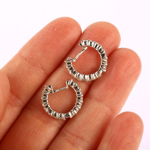 1147 - A pair of 18ct white gold diamond hoop earrings, set with modern round brilliant-cut diamonds, total... 