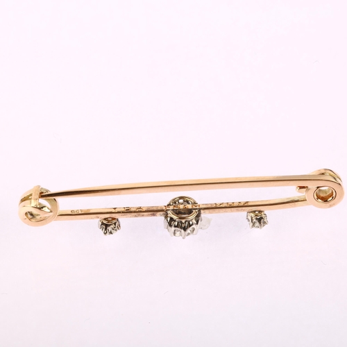 1149 - An early 20th century 9ct gold three stone diamond bar brooch, claw set with old European-cut diamon... 