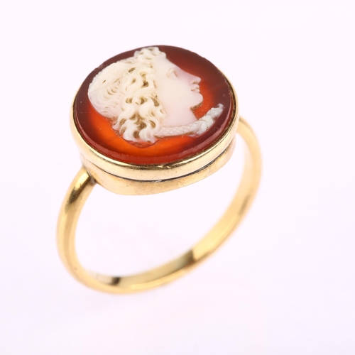 1150 - An Antique sardonyx hardstone cameo ring, relief carved depicting profile head of Mercury with wings... 