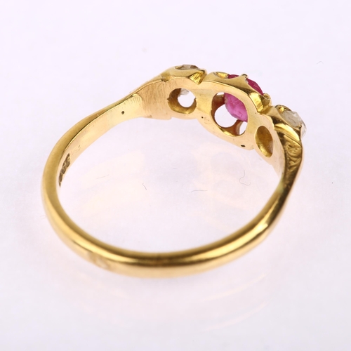 1162 - An early 20th century 18ct gold three stone ruby and diamond gypsy ring, ruby measures 4.34 x 3.90 x... 