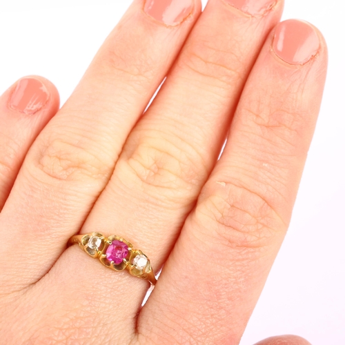 1162 - An early 20th century 18ct gold three stone ruby and diamond gypsy ring, ruby measures 4.34 x 3.90 x... 