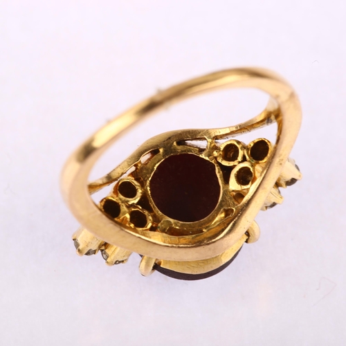 1163 - A late 20th century star ruby and diamond eye dress ring, unmarked gold settings with oval cabochon ... 