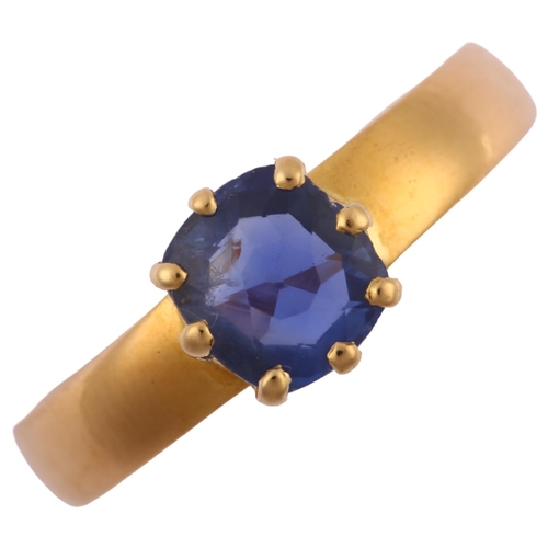 1167 - A mid-19th century solitaire sapphire ring, unmarked high carat gold settings with old-cut sapphire,... 