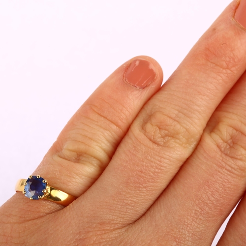 1167 - A mid-19th century solitaire sapphire ring, unmarked high carat gold settings with old-cut sapphire,... 