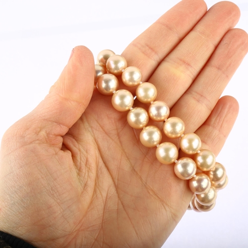 1177 - A single-strand cultured pearl necklace, with 9ct white gold ball clasp, pearl diameter 10.1mm, neck... 