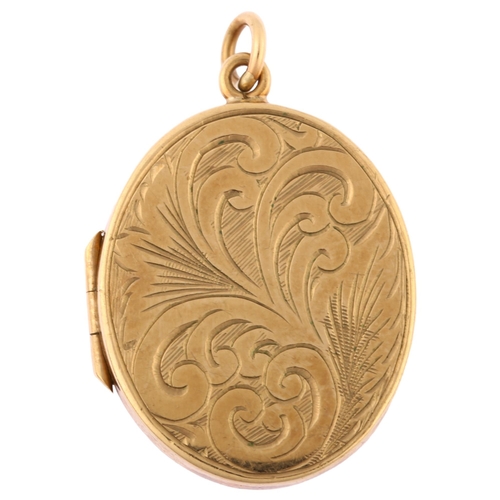 1181 - A late 20th century 9ct gold photo locket pendant, oval form with engraved foliate decoration, maker... 