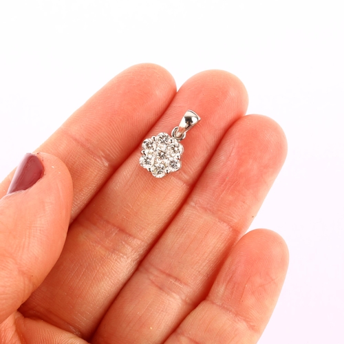 1188 - A modern 18ct white gold diamond flowerhead cluster pendant, prong set with modern round brilliant-c... 