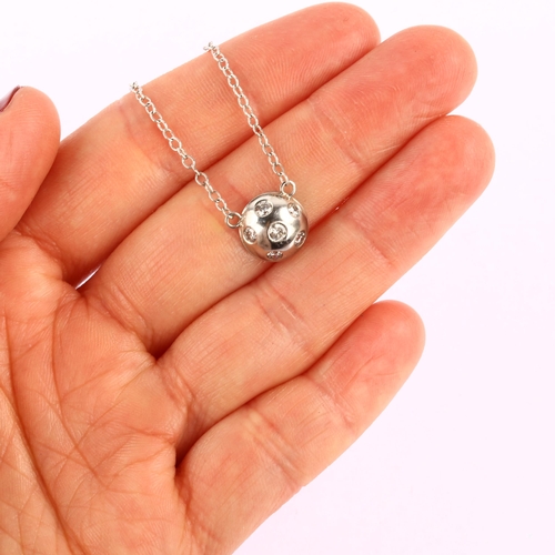 1190 - A modern 9ct white gold diamond bombe pendant necklace, set with modern round brilliant-cut diamonds... 