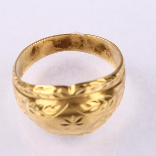 1195 - A late 20th century Continental gold bombe ring, with engraved floral decoration, setting height 11.... 