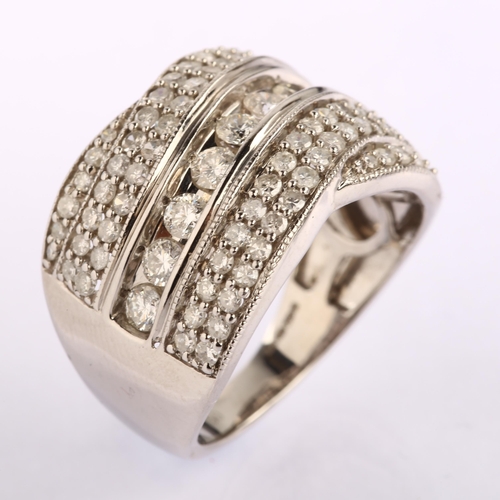 1203 - A large modern 18ct white gold diamond band ring, set with modern round brilliant and single-cut dia... 